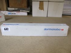 A boxed Dormakaba concealed fire door closer (PN: ITS 96).