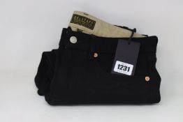 A pair of as new Belstaff long slim jeans in black (Size 28 - RRP £160).
