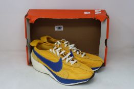 A pair of as new Nike Moon Racer QS trainers (UK 11 - No box lid).