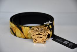 An as new Versace Gold Hibiscus print Plazzo belt (Size 100 - RRP £370).