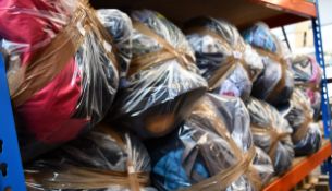 Nine bags of assorted clothing and related items.