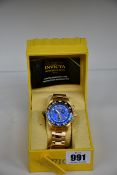 A boxed Invicta Model 29986 men's blue faced wrist watch.