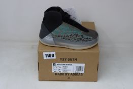 A pair of infants as new Adidas Yeezy QNTM trainers (Size 9K).