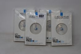 Four boxed as new La Roche-Posay My Skin Track UV wearable sensors.