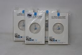 Four boxed as new La Roche-Posay My Skin Track UV wearable sensors.
