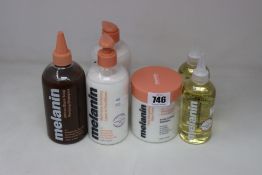 A collection of Melanin hair care products to include two softening leave-in conditioners (475ml),