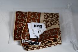 A pre-owned Christian Dior silk printed scarf (Excellent condition).