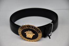 An as new Versace oval medallion leather belt (Size 85 - RRP £350).