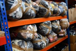 Thirteen bags of assorted clothing and related items.