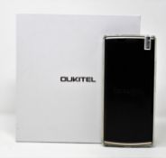 A boxed as new Oukitel K7 64GB Smartphone in Black (Box opened, UK plug adaptor required).