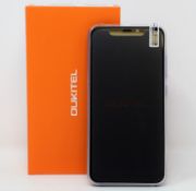 A boxed as new Oukitel C12 Pro 16GB Smartphone in Purple (Box opened, UK plug adaptor required).