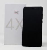 A boxed as new Xiaomi Redmi 4X 32GB Smartphone in Black (Box opened, UK plug adaptor required) (