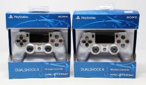 Two boxed as new Sony PlayStation DualShock 4 Wireless Controllers in Silver.