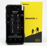 A boxed as new Ulefone Armor X 16GB Rugged Smartphone in Dark Grey (Box opened, UK plug adaptor