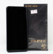 A boxed as new ASUS Zenfone Pegasus 4S X018DC 32GB Smartphone in Dark Blue (Box opened, UK plug