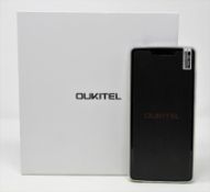A boxed as new Oukitel K8 64GB Smartphone in Silver Grey (Box opened, UK plug adaptor required).