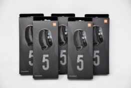 Five boxed as new Xiaomi Mi Smart Band 5 Fitness Trackers in black.