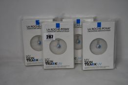 Four boxed as new La Roche-Posay My Skin Track UV wearable sensors.