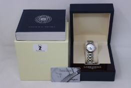 A ladies boxed as new Longines PrimaLuna 30mm watch in silver (RRP £1190).