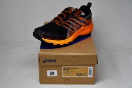 A pair of as new Asics Gel-Trabuco 9 G-TX trainers (UK 9.5).