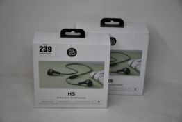 Two as new boxed and sealed Bang & Olsen moss green Beoplay H5 wireless earphones (SN31089925).