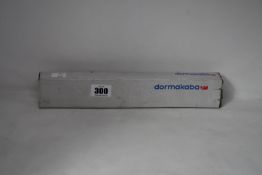 A boxed Dormakaba concealed fire door closer (PN: ITS 96).