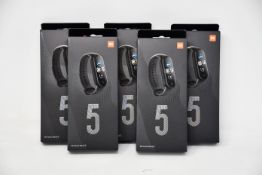 Five boxed as new Xiaomi Mi Smart Band 5 Fitness Trackers in black.