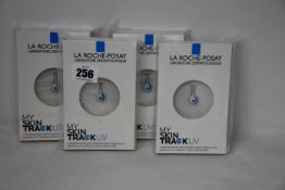 Four boxed as new La Roche-Posay My Skin Track UV wearable sensors.