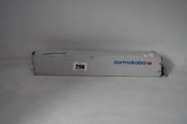 A boxed Dormakaba concealed fire door closer (PN: ITS 96).