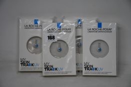 Four boxed as new La Roche-Posay My Skin Track UV wearable sensors.