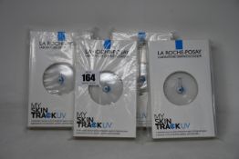 Four boxed as new La Roche-Posay My Skin Track UV wearable sensors.