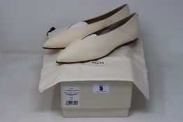 A pair of as new Aeyde Moa flats in cream (EU 39).