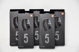 Five boxed as new Xiaomi Mi Smart Band 5 Fitness Trackers in black.