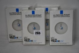 Four boxed as new La Roche-Posay My Skin Track UV wearable sensors.
