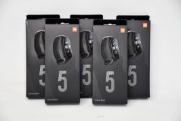 Five boxed as new Xiaomi Mi Smart Band 5 Fitness Trackers in black.