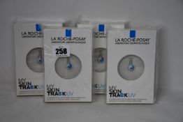 Four boxed as new La Roche-Posay My Skin Track UV wearable sensors.