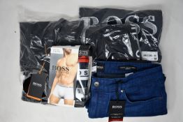 As new Hugo Boss clothing; a black polo shirt (XXXL), leggings (M), T-shirt (S), jeans (W34/L36) and