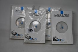 Four boxed as new La Roche-Posay My Skin Track UV wearable sensors.