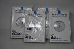 Four boxed as new La Roche-Posay My Skin Track UV wearable sensors.