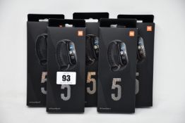 Five boxed as new Xiaomi Mi Smart Band 5 Fitness Trackers in black.