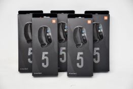 Five boxed as new Xiaomi Mi Smart Band 5 Fitness Trackers in black.