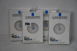 Four boxed as new La Roche-Posay My Skin Track UV wearable sensors.
