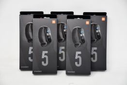 Five boxed as new Xiaomi Mi Smart Band 5 Fitness Trackers in black.