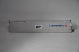 A boxed Dormakaba concealed fire door closer (PN: ITS 96).