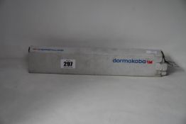 A boxed Dormakaba concealed fire door closer (PN: ITS 96).