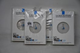 Four boxed as new La Roche-Posay My Skin Track UV wearable sensors.