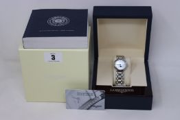 A ladies boxed as new Longines PrimaLuna 30mm watch in silver (RRP £1190).