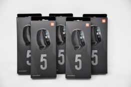 Five boxed as new Xiaomi Mi Smart Band 5 Fitness Trackers in black.