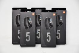 Five boxed as new Xiaomi Mi Smart Band 5 Fitness Trackers in black.