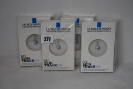 Four boxed as new La Roche-Posay My Skin Track UV wearable sensors.
